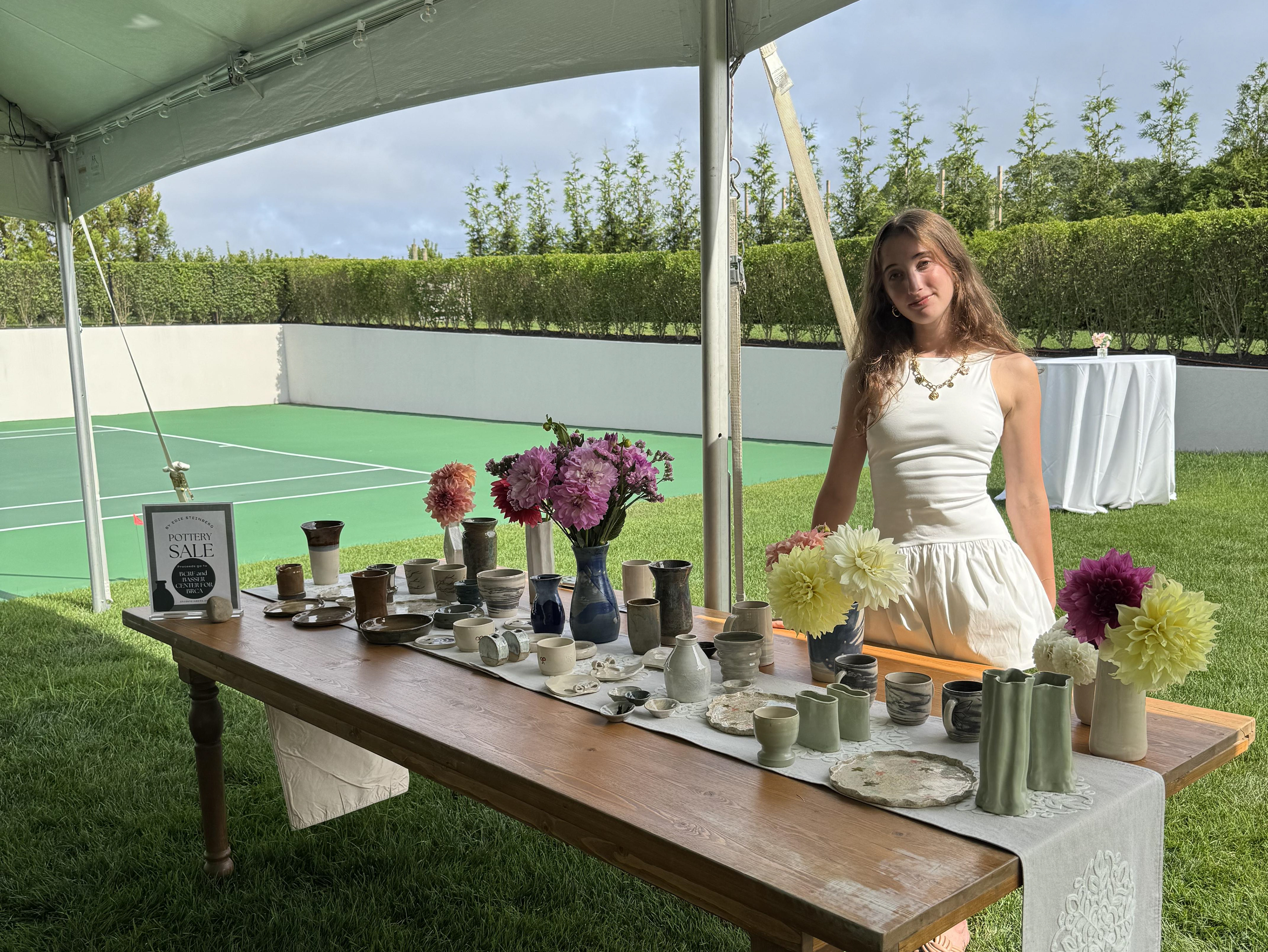 Edie Steinberg at her pottery display